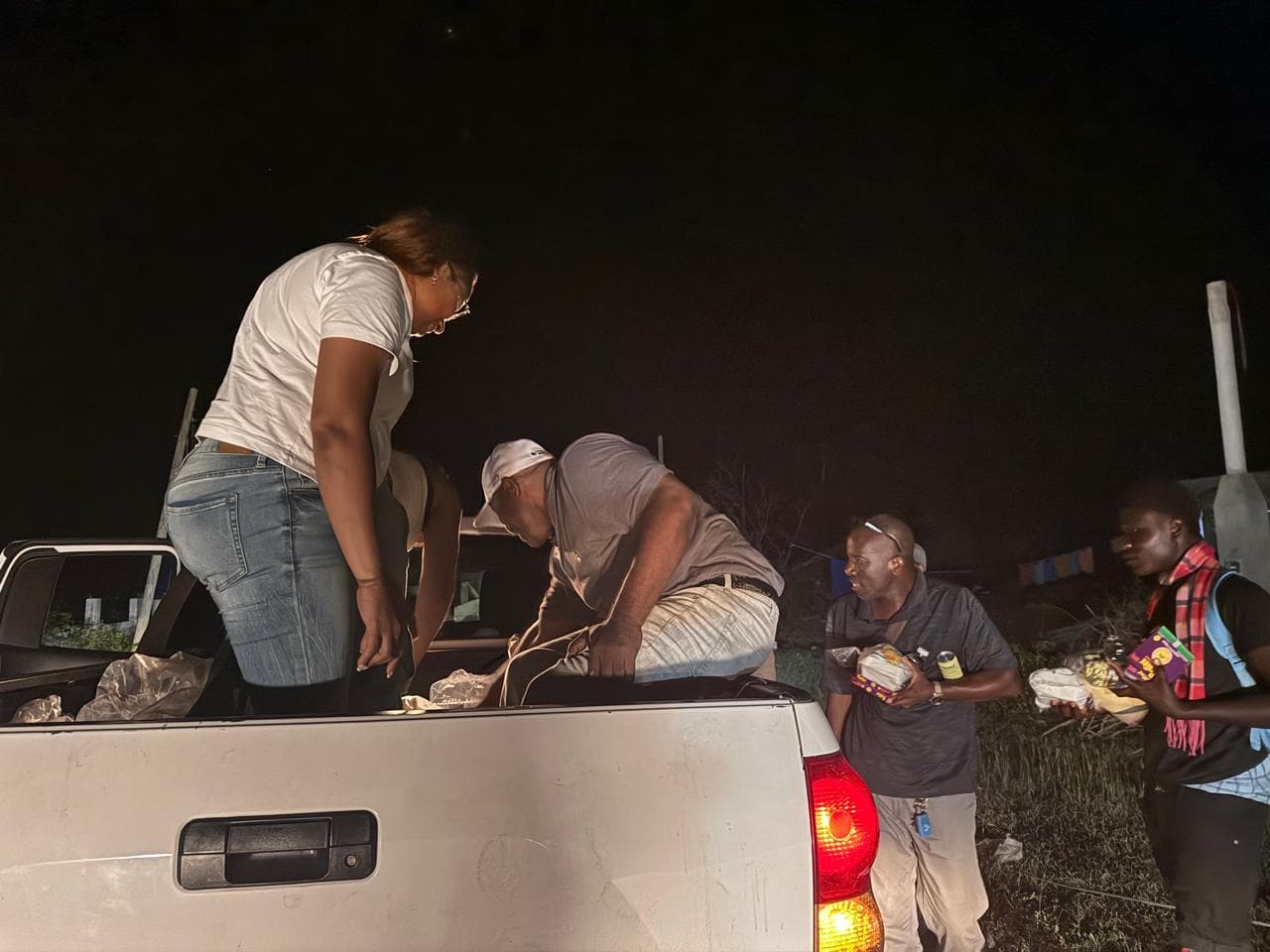 Community members receiving aid supplies